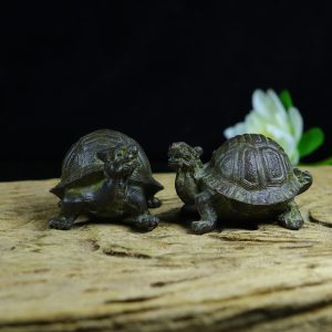 A pair of suspected copper-based tortoise-shaped ornaments from the old collection