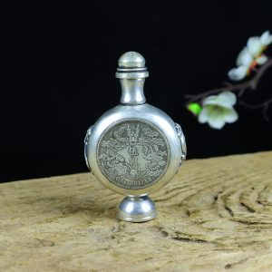 Old collection treasure: A copper gilded with silver and inlaid with silver dollar dragon pattern snuff bottle