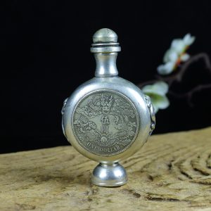 Old collection treasure: A copper gilded with silver and inlaid with silver dollar dragon pattern snuff bottle