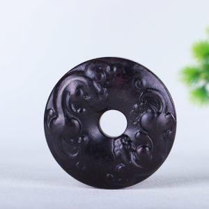 Old collection, suspected strong magnetic meteorite with dragon pattern peace pendant.